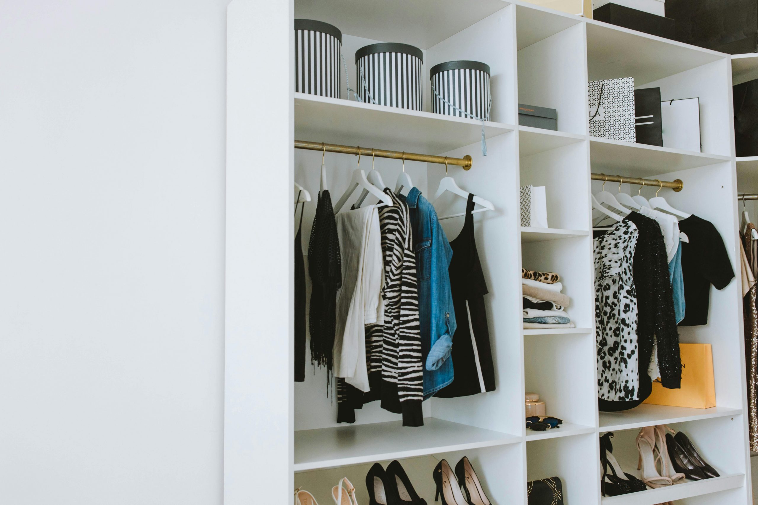 big closet with clothes and shoes